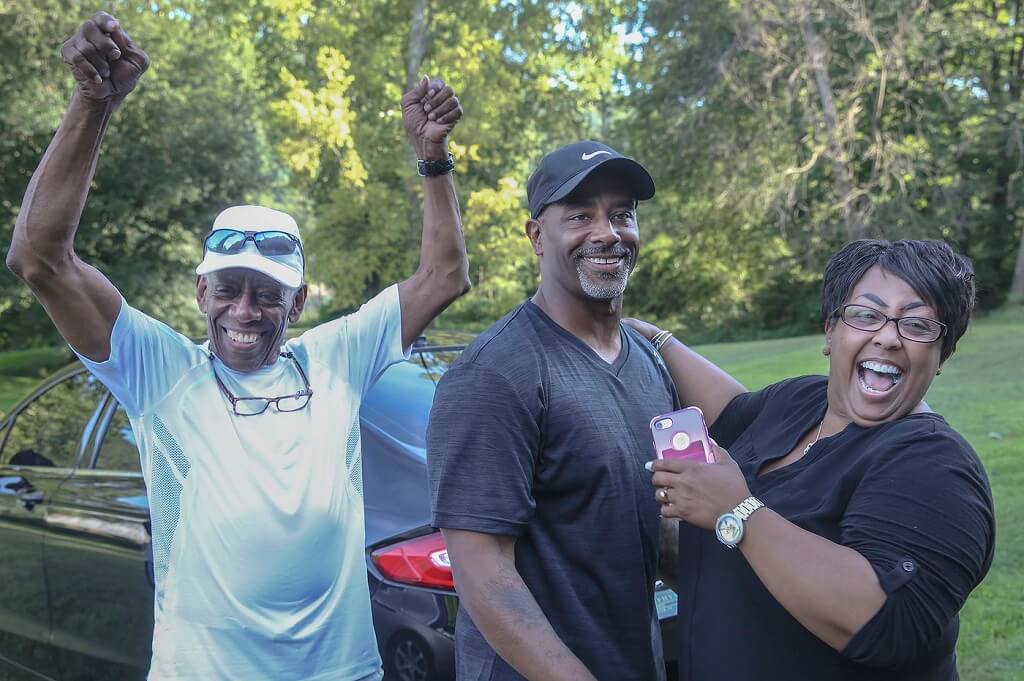 Chester Hollman III, middle, with his father and sister after he was released from prison. Photo: Pennsylvania Innocence Project. 