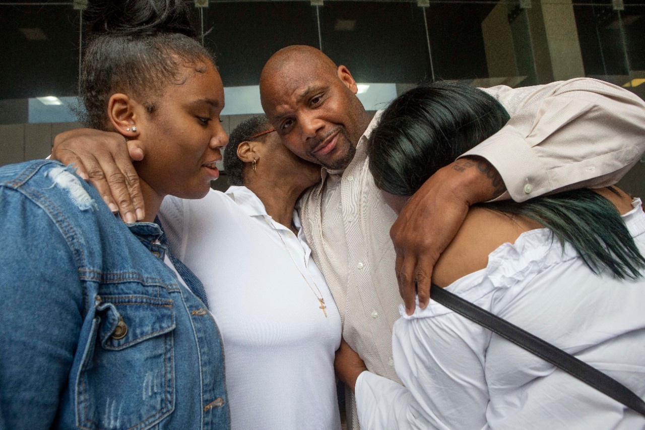 Chris Miller embraces his family after his exoneration on June 21, 2018. Photo: Joseph Fuqua II courtesy of the Ohio Innocence Project.