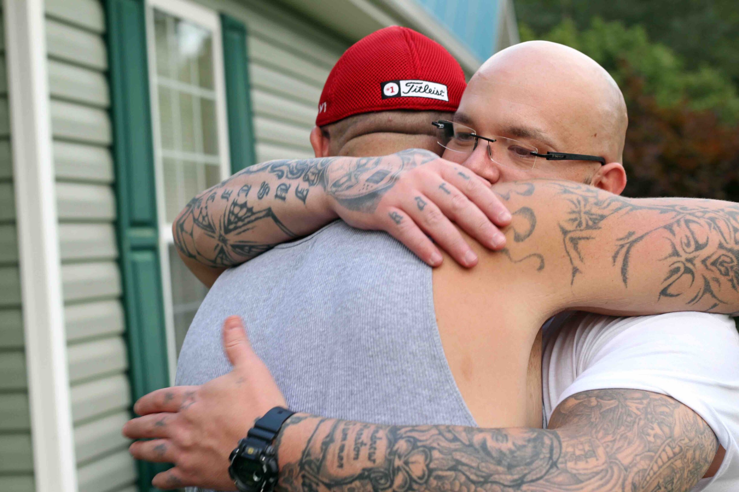 Philip hugging his brother, Nathan, who was also wrongly convicted of the same crime. Photo: Kyle Jenkins.