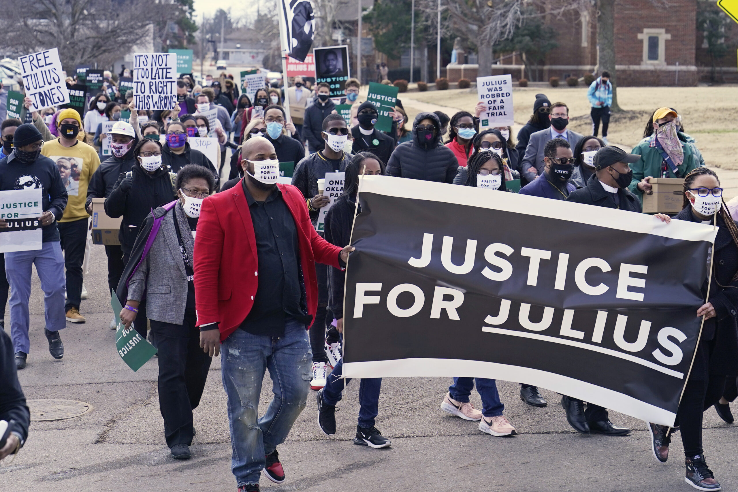 Supporters of Julius Jones, who has been on death row in Oklahoma since 1999, march to the offices of the Oklahoma Pardon and Parole Board, Thursday, Feb. 25, 2021, in Oklahoma City, where they presented a petition with over 6.2 million signatures, calling for Jones' death sentence to be commuted. (Image: AP Photo/Sue Ogrocki)