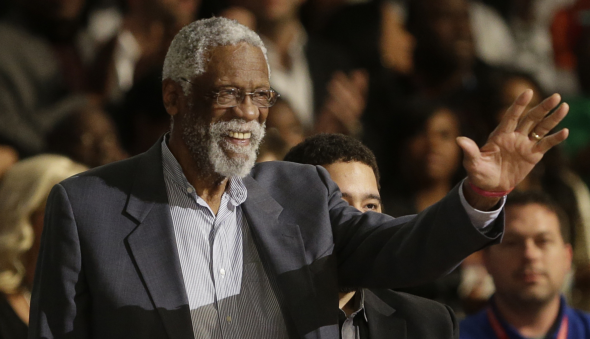 Former NBA player Bill Russell waves to the crowd during the NBA All Star basketball game, Sunday, Feb. 16, 2014, in New Orleans. (Image: AP Photo/Gerald Herbert)