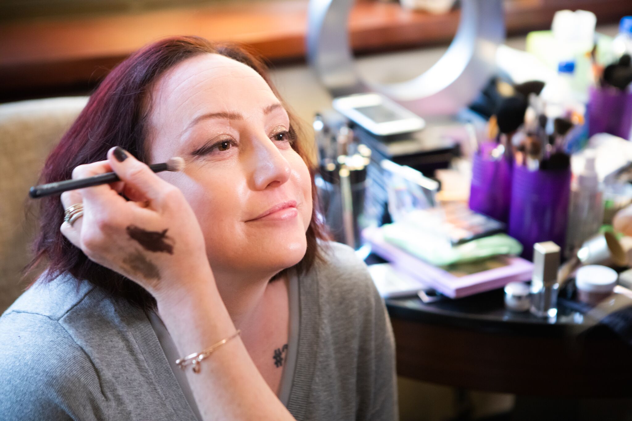 Lobato has her makeup applied by a Glam4Good team member before the Innocence Project's annual gala. Photo by Sioux Nesi.