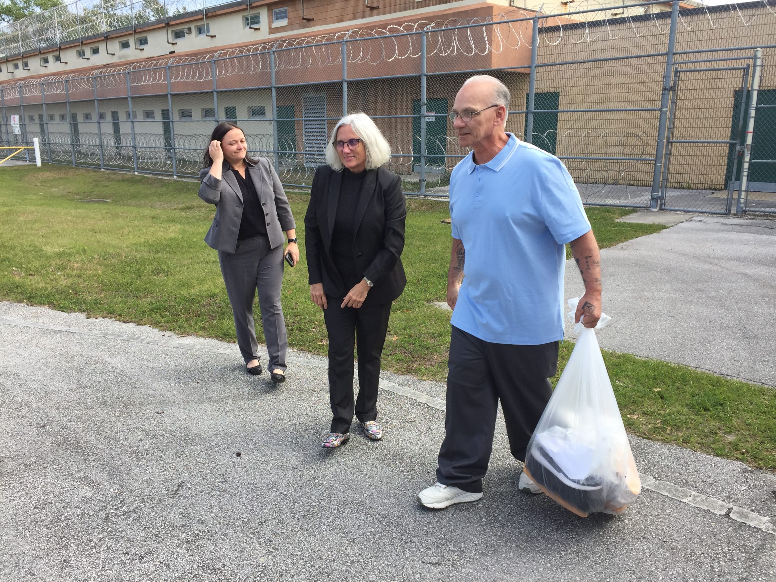 Paul Hildwin walking out of Hernando County jail on March 9, 2020 greeted by Kate O'Shea (left), investigator, and Lyann Goudie (right) of Goudie & Kohn, P.A. Photo by Anthony Scott/Florida Innocence Project. 