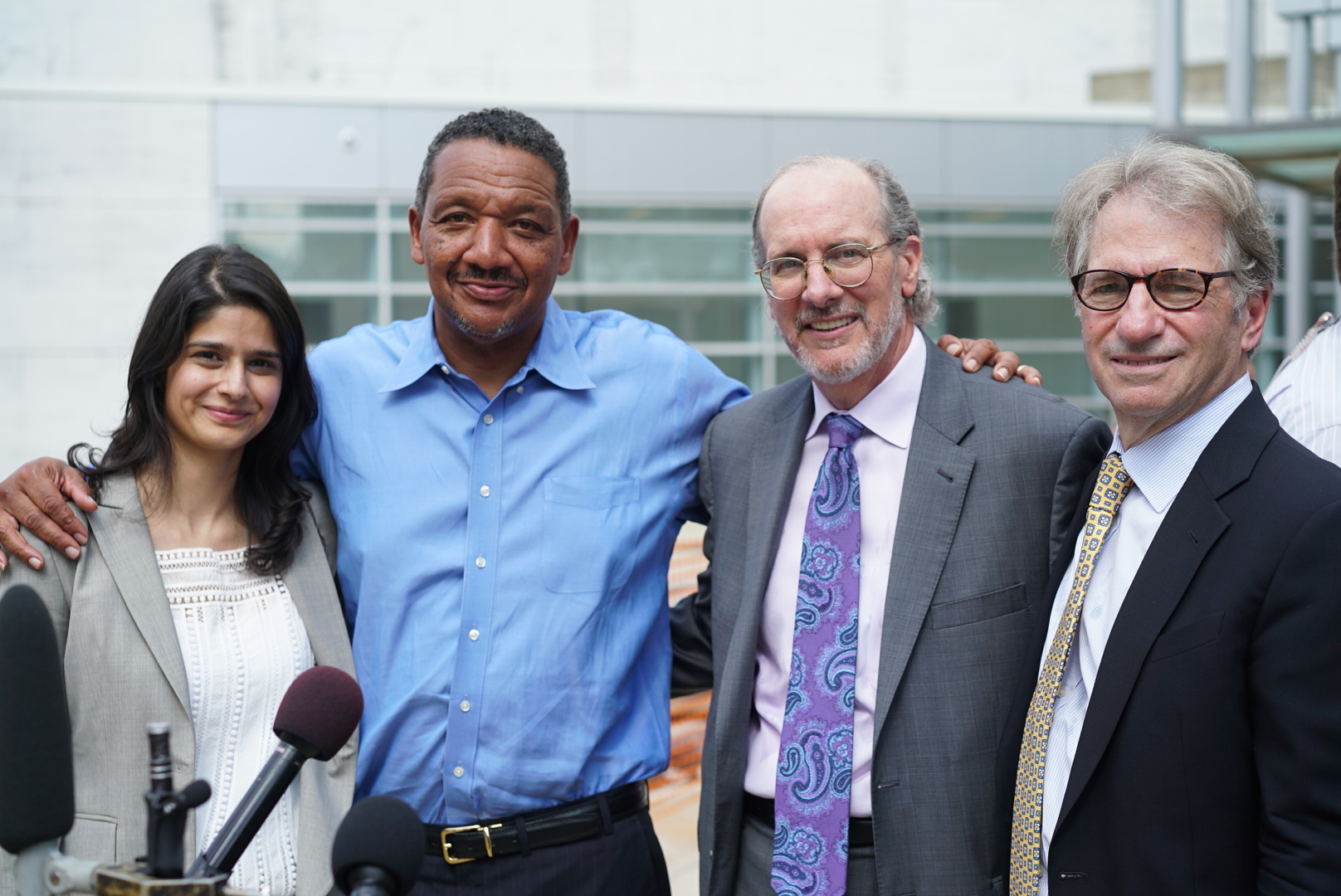 Howard with his legal team, Seema Saifee, James Cooley (in grey) and Barry Scheck (right).