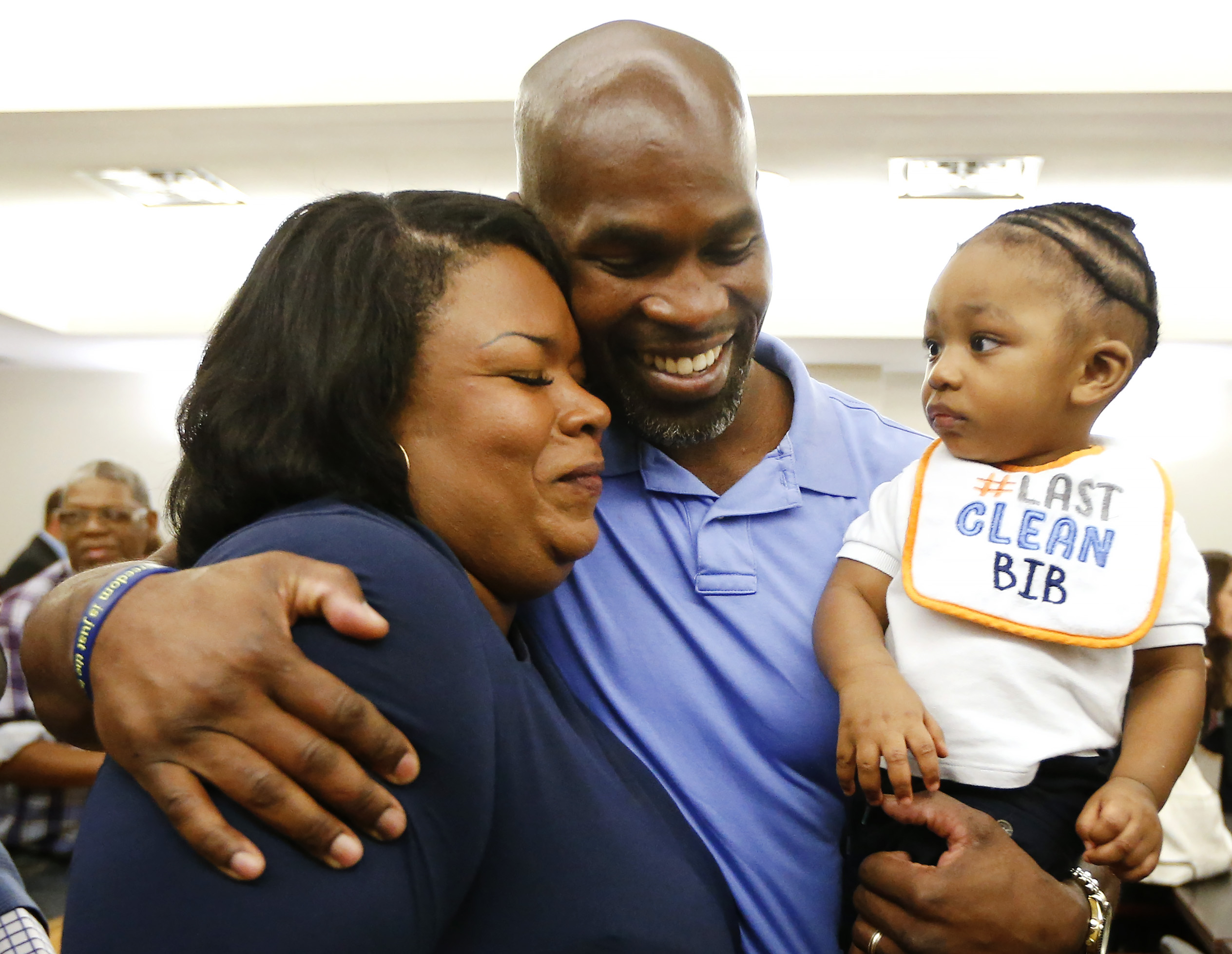 John Nolley embraces his wife Kimya and son John Nolley III at his exoneration on October 3, 2018. Photo: Ron Jenkins.