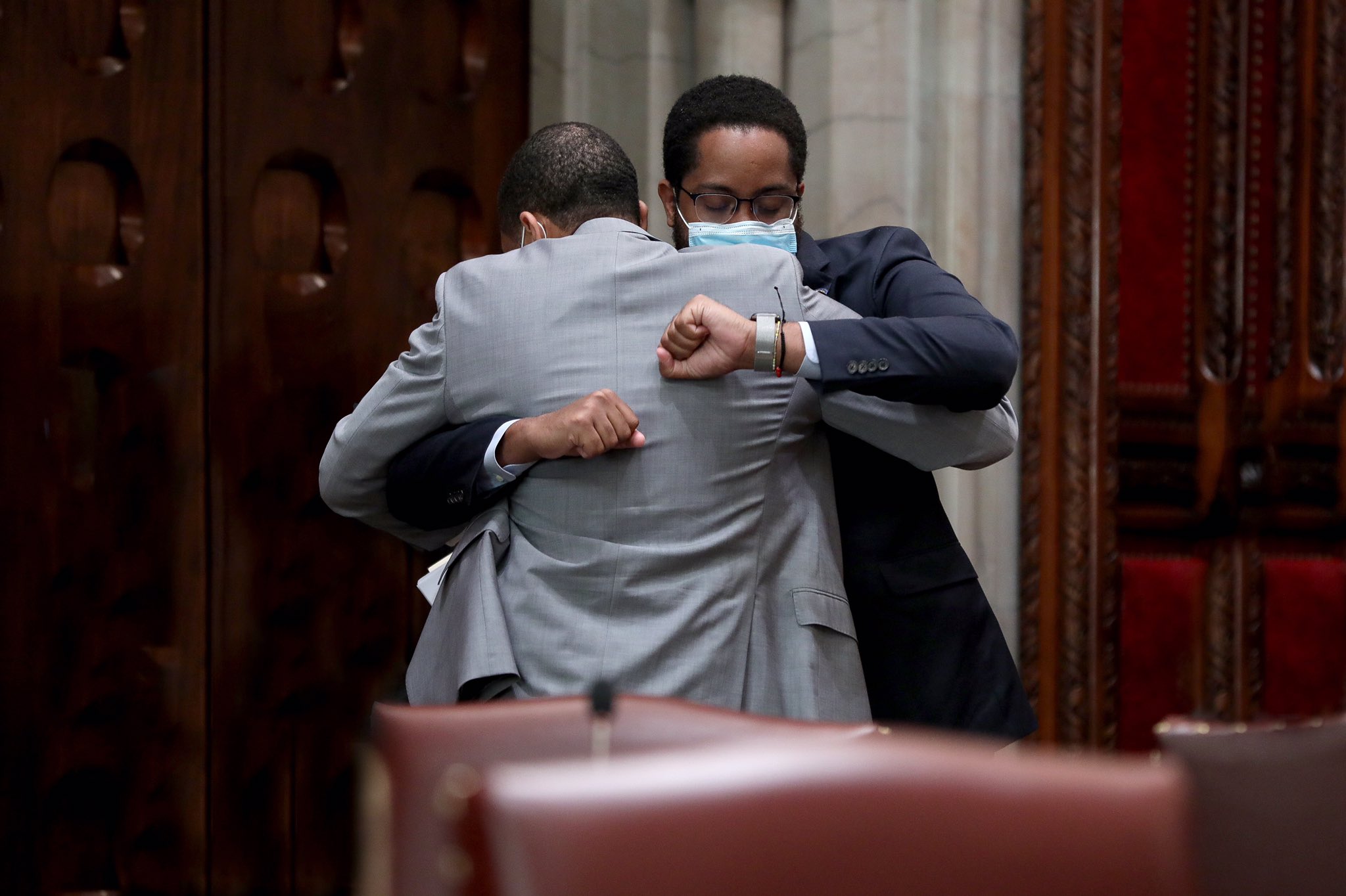 Photo of Senator Zellnor Myrie hugging Senator Jamaal T. Bailey after voting in favor of repealing 50-A. Photo courtesy of NY Senate Media Services Office.