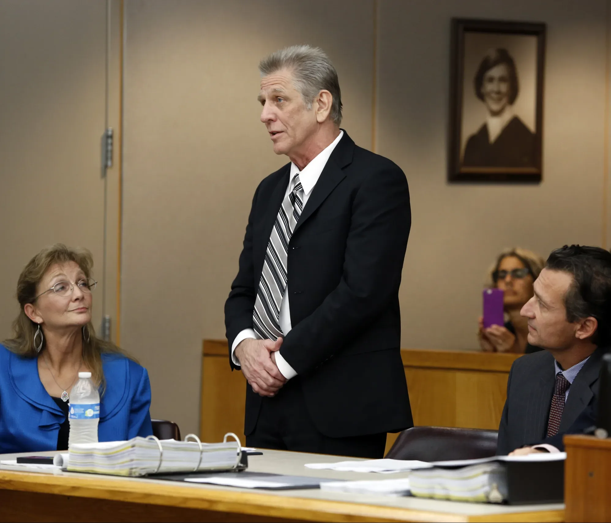 Steven Mark Chaney addresses the court during a hearing in a Dallas courtroom where a court reversed his 1987 murder conviction because of discredited bite mark testimony.ÊPhotographed on Monday, October 12, 2015. Innocence Project Attorneys M. Chris Fabricant  and Barry Cshack are on the right and Dallas Public Defenders Exoneration Attorney Julie Lesser is on the left. (Photo copyright Lara Solt)