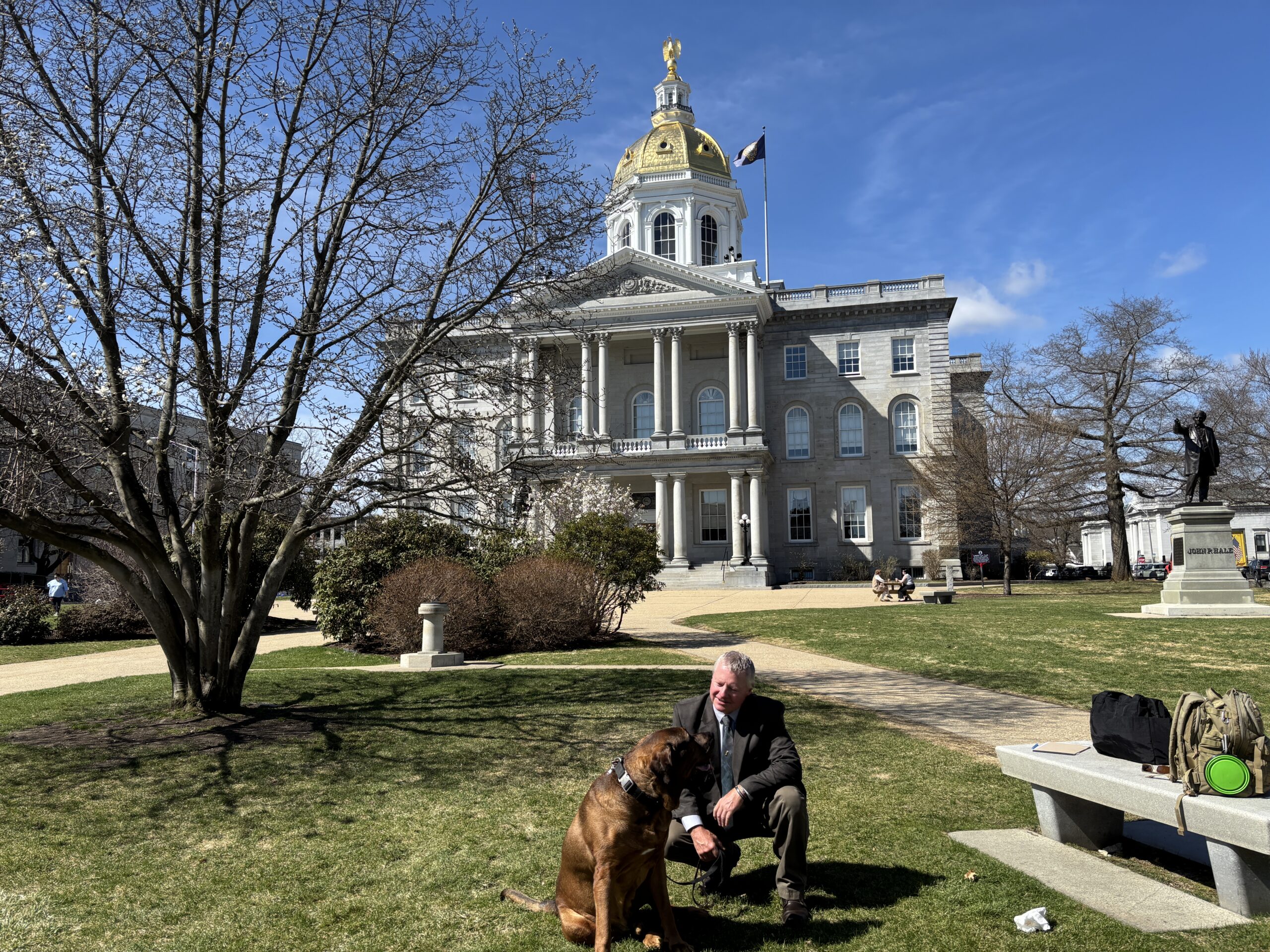 Exoneree Scott Hornoff in NH with his service dog Tuukka.