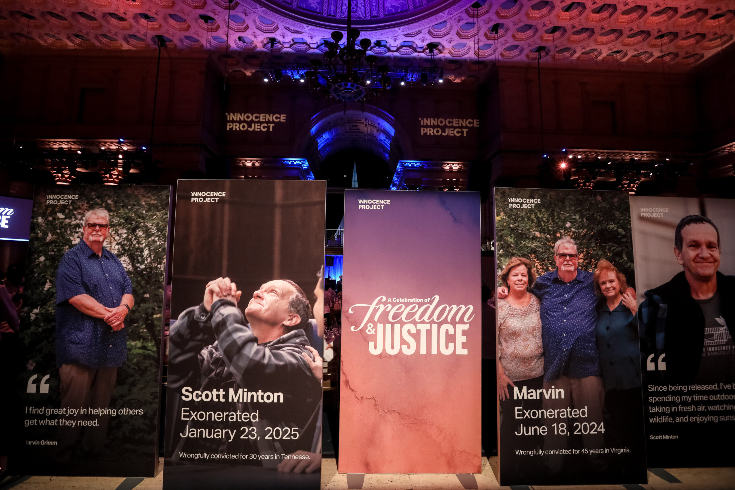 Banners celebrating exonerees Scott Minton and Marvin Grimm, Jr. at the 2025 
