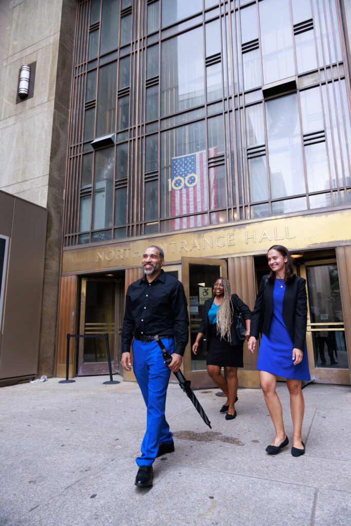 Brian Boles walks out of the Manhattan Criminal Courthouse alongside Innocence Project Senior Attorney Jane Pucher following his exoneration on July 10, 2025. (Image: Nick Castle/Innocence Project)