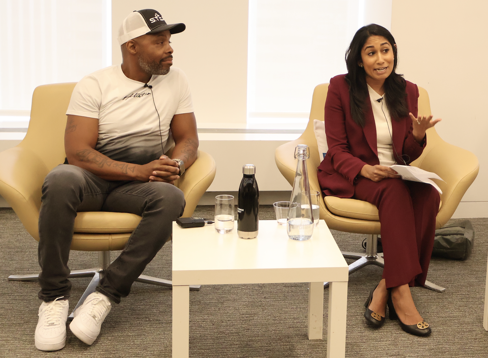 Innocence Project Exoneree Termaine Hicks and Intake Strategic Initiatives Attorney Yosha Gunasekera speak to associates at Ropes & Gray. (Photo: Louise Liu for Innocence Project)