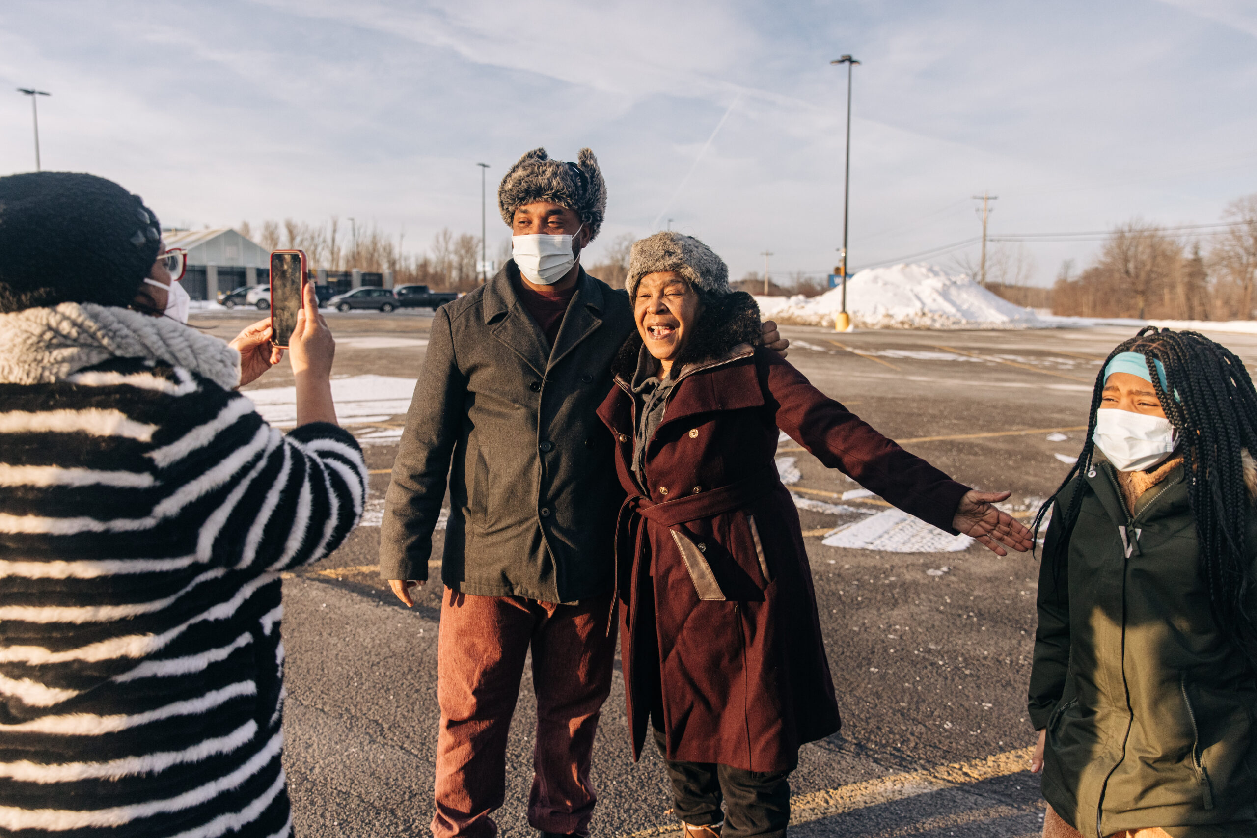 Renay Lynch takes a picture with her son after being freed in January 2022. (Image: Jeenah Moon/Innocence Project)