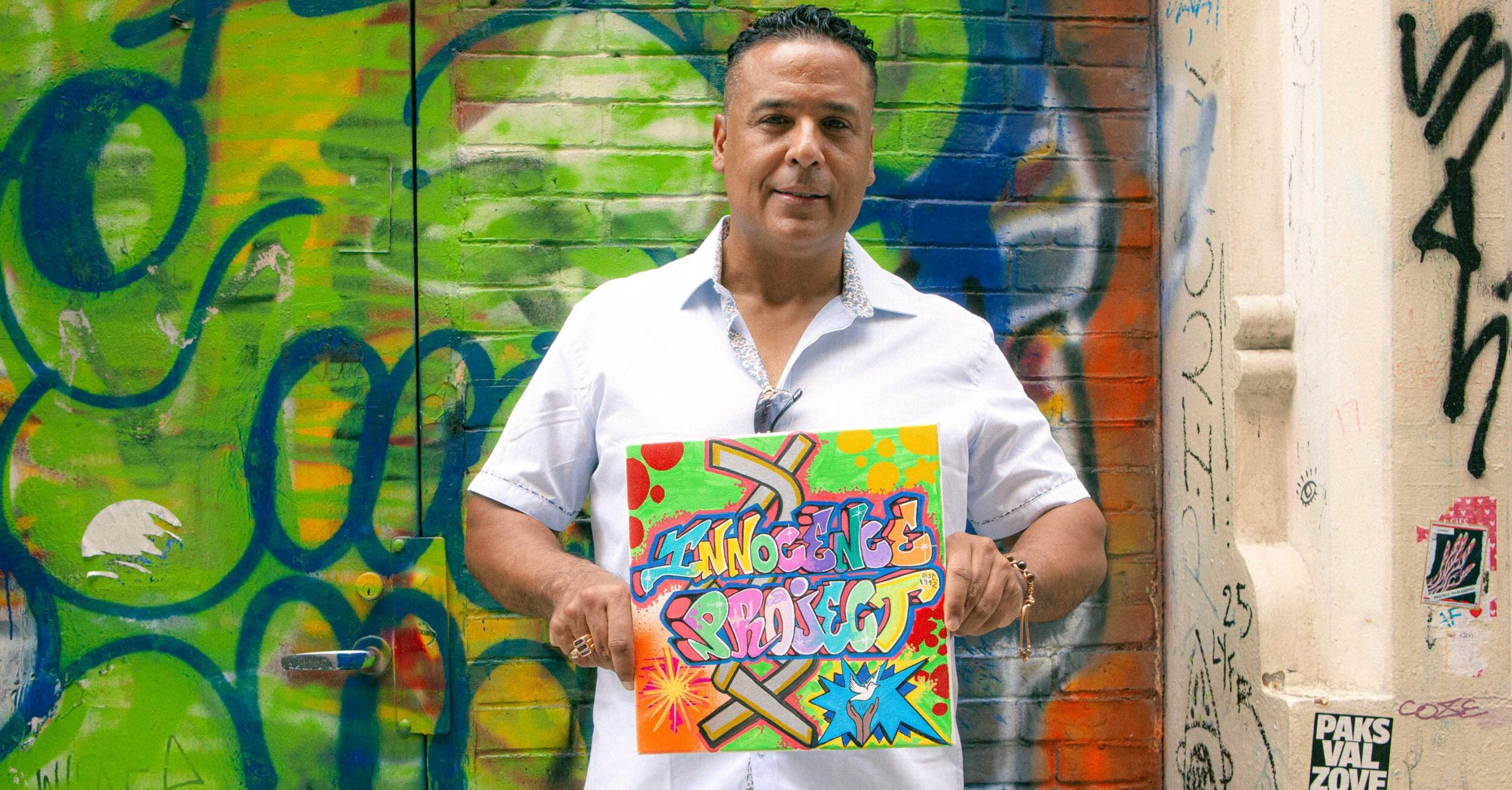 Fernando Bermudez holding the piece he created for Innocence Project's anniversary collection. (Image: Daniele Selby/Innocence Project)