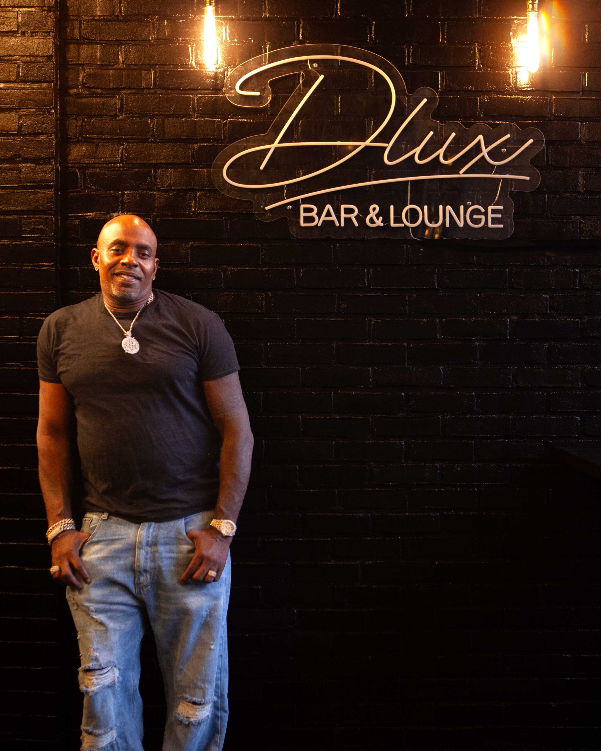 Jabar Walker at Lux Bar and Grill, which he co-owns with his brother, on July 28, 2026. (Image: Daniele Selby/Innocence Project)