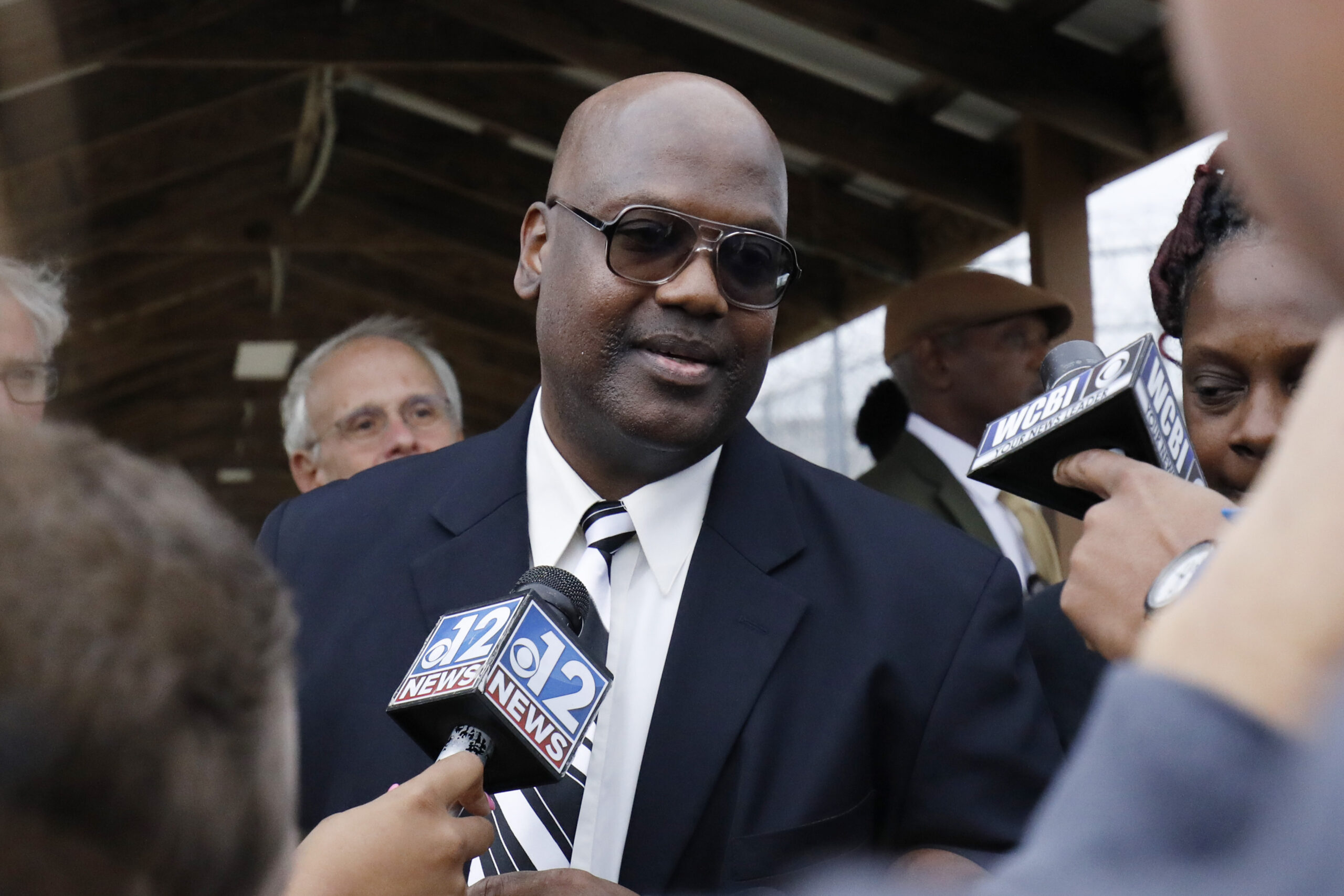 FILE - In this Monday, Dec. 16, 2019 file photo, Curtis Flowers speaks with reporters as he exits the Winston-Choctaw Regional Correctional Facility in Louisville, Miss. Mississippi's new attorney general must decide whether to take a quadruple murder case to a seventh trial. Curtis Flowers has had two mistrials and four reversed convictions in connection with the 1996 slayings of four people at a furniture store. (AP Photo/Rogelio V. Solis, File)